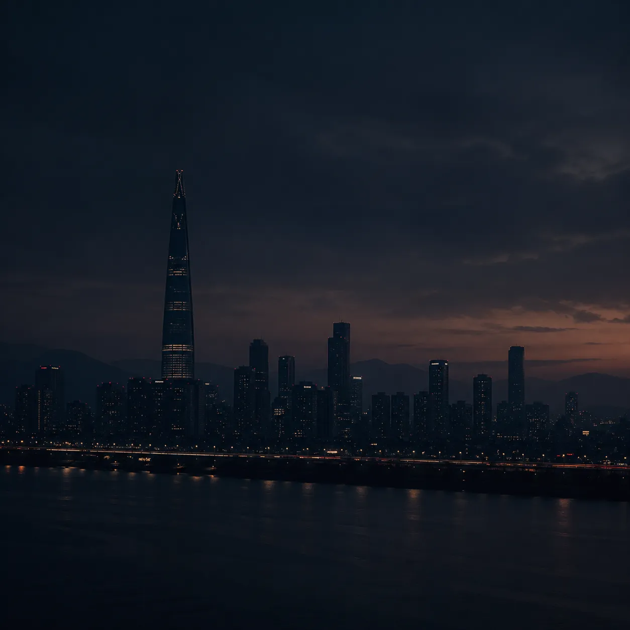 해질녘 강 너머로 보이는 도시 야경 스카이라인